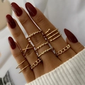 10-piece gold twisted geometric stackable ring set worn on model fingers with red nails - Multi-layer Stacking Combination Set (HS1438-2) / 10-Piece Set / Gold