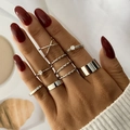 Eight-piece silver geometric ring set with twist and cross designs on female hand - Micro Inlaid Rhinestone Stacking Set (HS1438-3) / 8-piece Set / Silver