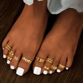 10-piece gold toe ring set featuring star, moon and geometric designs on wooden background - Gold Style (HS1447-1)