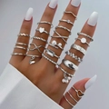 30-piece silver geometric ring set featuring butterfly, pearl and heart charms on model - Bright Silver Decorative Set (HS1488-3)