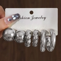 Three pairs of silver metallic earrings including ball studs and twisted hoops on a white card - Silver (HS1515-2)