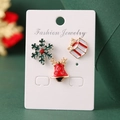 Christmas earring set with green snowflake, red bell, and gift box designs on display card - Christmas Snowflake Bell Stud Earrings (HS1537-4)