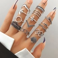 Retro silver bohemian ring set with butterfly, moon, and snake patterns on model's hand - Feather Moon Shell Snake (HS1475-45)