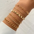 Set of 6 gold alloy bracelets with Cuban chains and rhinestones on woman's wrist - Gold Studded And Rhinestone Layered Set (HS1544-9)