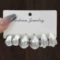 Three pairs of silver twisted organic droplet earrings on a display card - 3 Pairs Silver Organic Drop Style (HS1580-5)