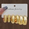 Three-pair set of polished and textured golden hoop earrings on jewelry card - 3 Pairs Gold Textured Polished Style (HS1580-9)
