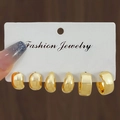 Three pairs of chunky gold twist hoop earrings set displayed on a fashion jewelry card - Gold Polished Hoop Earring Set (HS1580-21)