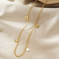 Elegante collana in acciaio dorato con ciondoli lettere D I R e una piccola stella - Stile Stella Lettera DIR Dorato (BXG037-18)