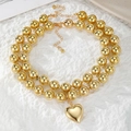 Elegante collar de cuentas doradas con un colgante de corazón 3D pulido para mujer moda - Estilo Corazón de Cuentas Doradas Doble Capa