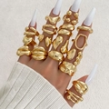 Detail of 17-piece gold fashion ring set featuring heart and oval shapes on model hand - Style (HS2032-6)