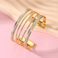 Detail of layered gold open cuff bracelet featuring matte silver glitter and wavy texture - Glitter Multi-layer Open Style (HS1974-13)