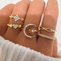 Detailed close-up of a 5-piece gold ring set featuring star, moon, and heart designs with crystals - Star Moon Sun Infinity 5-Piece Set (HS1981-6)