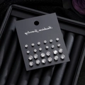 Set of 12 pairs of various sized round cubic zirconia stud earrings on black card - Round Style (HS1924-2)