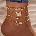 Four-piece gold layered anklet set featuring butterfly, beads, and love script pendant - Golden Four Layer Love Butterfly (HS1926-3)
