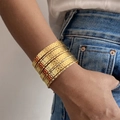 Bohemian gold hammered metal stacked bangles set with seven individual wave bands - Hammered Texture Stackable Style (HS1974-3)