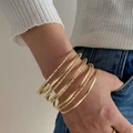Set of 7 gold stackable geometric bangles including smooth and twisted rope designs - Twisted Rope Stackable Rings Style (HS1974-4)