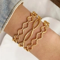 Set of three wave-shaped gold metal bangles for women on wrist in casual style - Wave Cross Combination Style (HS1974-7)