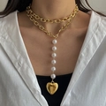 Layered gold chain necklace with round pearls and a mirror heart pendant on a female model - Gold Y-shaped Chain Patchwork Pearl Heart Necklace (HS1979-11)