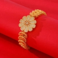 Exquisite gold plated floral bracelet with white zircon petals on a red textured display - Daisy Style (SL004) / SL004