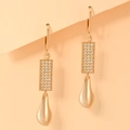 Macro detail of gold-plated lever-back earrings with cubic zirconia stones and metal drops - Pave Rhinestone Rectangle Flowing Water Drop Style (EH101)