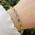 Detail of 18k gold plated bracelet featuring emerald green oval cubic zirconia stones - Dark Green (7)