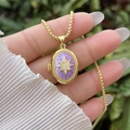 Detail of 18K gold plated locket with purple inlay and sparkling North Star pendant - 18K Gold / Purple