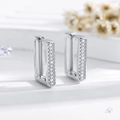 Macro shot of silver geometric rectangular hoop earrings with tiny white stones - Silver (EH548)