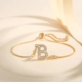 Detail showing gold plated adjustable B letter bracelet with cubic zirconia and slide clasp - Letter B