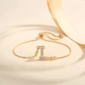 Detailed macro view of the gold adjustable box chain bracelet with letter I zircon pendant - Letter I