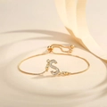 Detailed view of gold plated adjustable bracelet with a sparkling zircon letter S pendant - Letter S