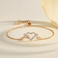 Verstellbares vergoldetes Herzarmband für Damen mit Zirkonia und Schleifen-Detail - Gold Stil (PSL122)