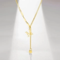 Detailed shot of golden alphabet M pendant necklace with long bar links and square charm - Letter M