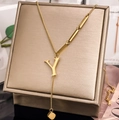 Detailed view of gold-plated letter Y pendant necklace on luxury display box - Letter Y