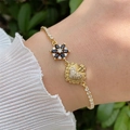 Detail of 18K gold-plated bracelet with black flower and crystal heart charm - Black
