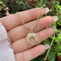 Detail of 18K gold-plated heart angel wing pendant with inlaid zircons and letter L - 18K Gold / Gold L