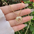 Detailed shot of 18K gold plated heart angel wings necklace with micro-set zircon letter M - 18K Gold / Gold M