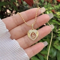 Detail of 18K gold plated heart pendant with S initial and zircon stones on ball chain - 18K Gold / Gold S