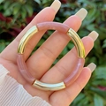 Detail view of pink marble resin and golden metal tube bracelet worn on hand - Pink Purple Marble Gold Style (4)