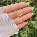 Detail view of 18K gold plated necklace with paved zircon interlocking oval pendants - Gold O