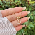 Detailed close-up of 18K gold plated letter Q pendant with cubic zirconia stones - Gold Q
