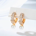 Detailed view of gold plated pearl earrings with sparkling pavé cubic zirconia setting - Wide Stripe Decoration (EH873)