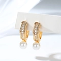 Detail of gold-plated drop earrings featuring pave-set zircons and elegant white round pearls - Pave Rhinestone Pendant Style (EH875)