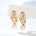 Detailed view of gold-plated earrings with pavé zircons and white round pearls - Rhombus Zircon Style (EH880)