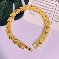 Detailed macro view of 24K gold plated heart link bracelet featuring matte and polished layers - 3D Double Heart Contrast (PSL178)