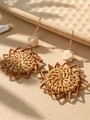 Close-up of bohemian sunflower woven rattan earrings with natural wooden beads - Brown (SE3658)