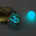 Detailed view of square hollow tree design pendant with glowing sky blue luminous bead - Luminous Light Blue