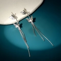 Detailed view of elegant silver butterfly earrings with long snake chain tassels - Frosted Butterfly Tassel Style (NE1290)