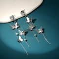 Detailed macro shot of silver butterfly tassel earrings with cubic zirconia stones - Butterfly Zirconia Stud Style (NE1303)