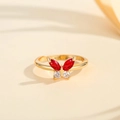 Macro shot of gold butterfly ring featuring red marquise and white round crystals - US 7 / Gold Red Zirconia