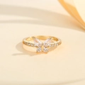 Macro shot of gold butterfly ring with marquise cut zircon stones and micro-pave details - US 7 / Gold White Zirconia
